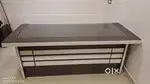 Unused Office table with 2.5' x 6' glass top and 2' x' 5 base