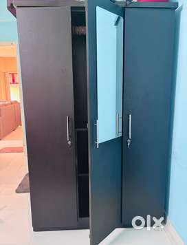 Modern Dark Wood Wardrobe with Mirror and Organized Storage