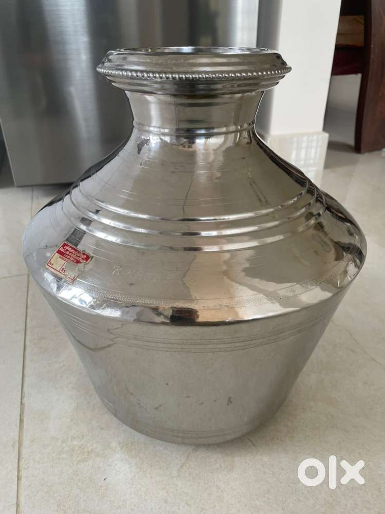 Two stainless steel thavalai and water storage container