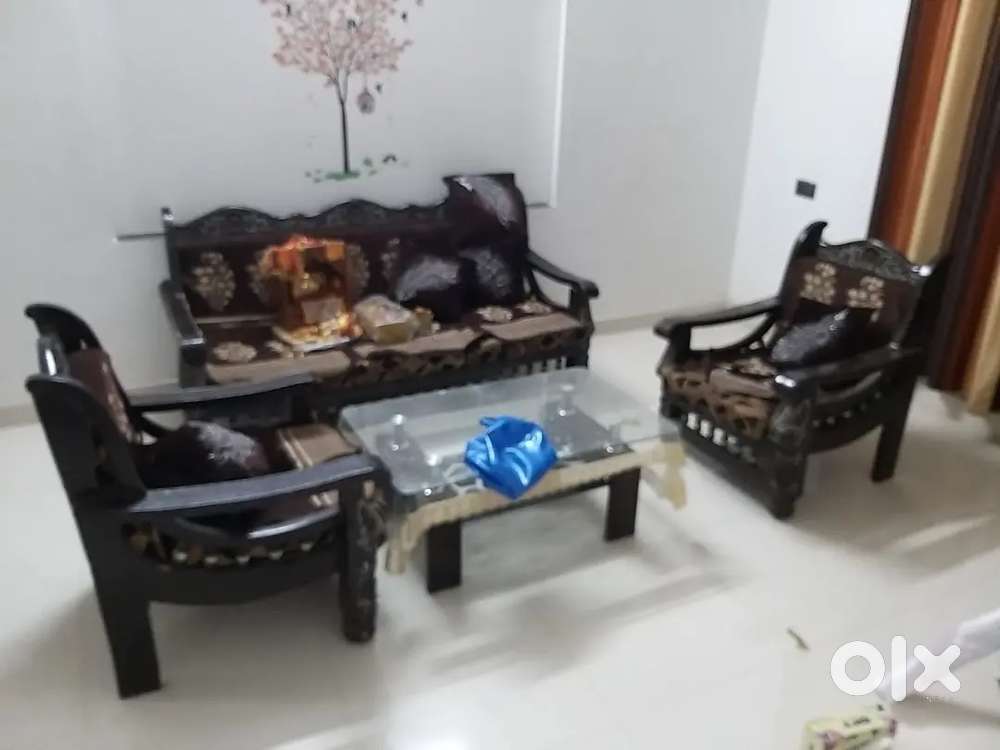 5 Seater Sofa set with glass centre table and 5 cushions.