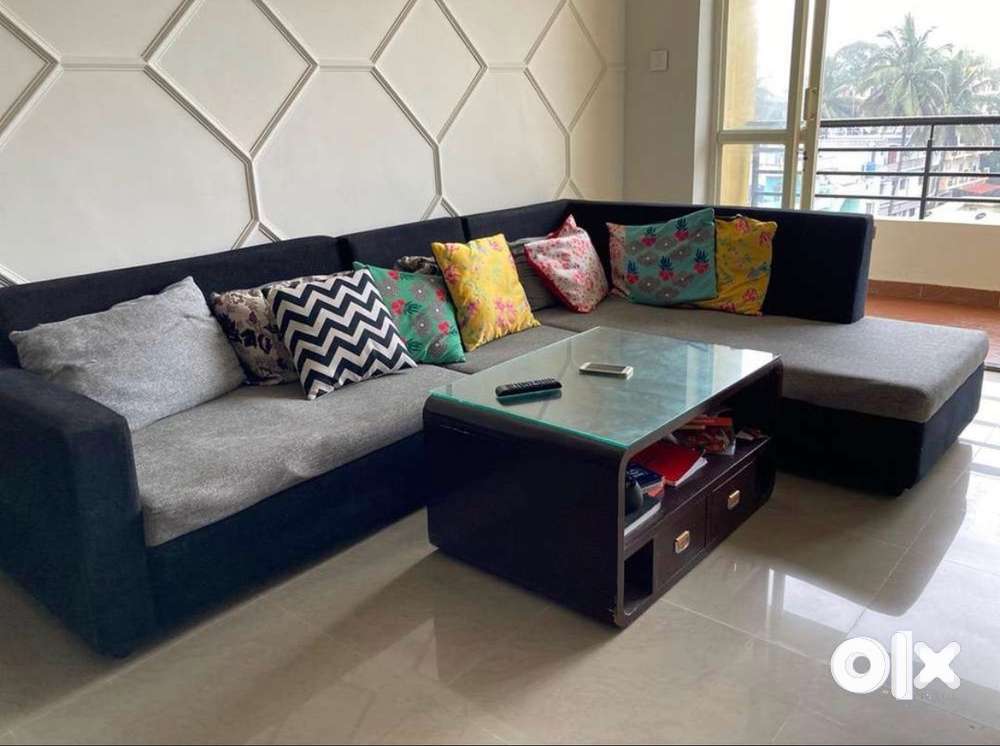 L shaped sofa with cushions