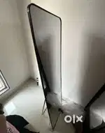 Mirror with a stand