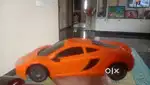 Toy car orange colour manual it's light are in good condition