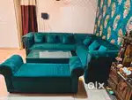 L shaped Seven seater sofa with a bench with centre table