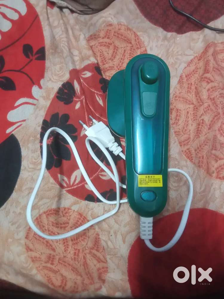 Dry iron with spray