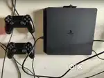 PlayStation PS4 console with 2 remotes and games