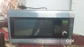 LG microwave, Gas Stove, Iron stand, Drawer, Centre table with glass.