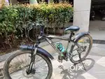 21 geared cycle with disc brakes and shockups