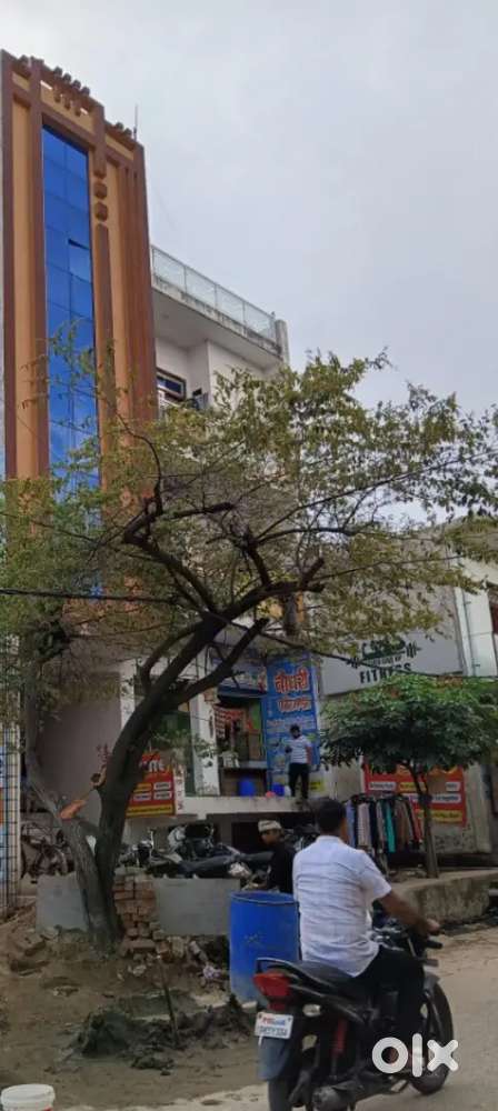 At main road, with two shops very near to house.