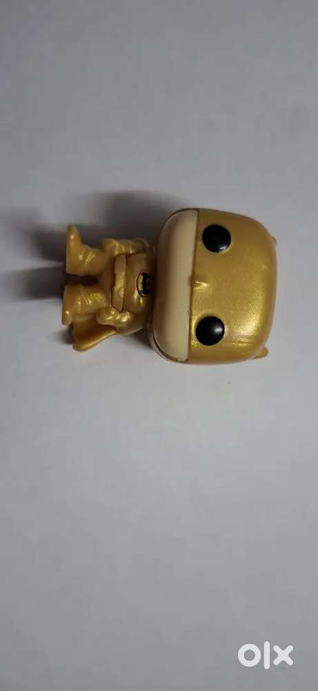 A golden batman funkopop from the candy Kinder Joy