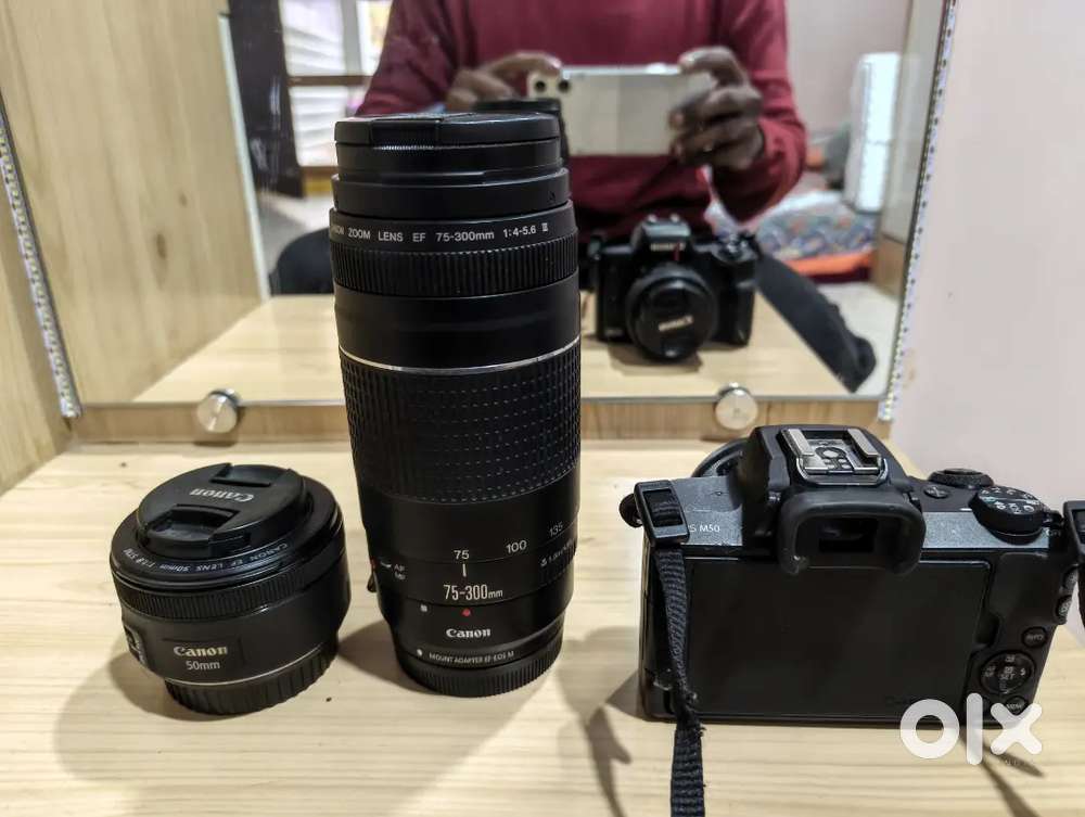 Canon EOS M50 with additional battery, lenses and 64gb 2 memory cards