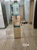 A blue star water dispenser with a cooling compartment with tank