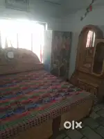 1room ,atth kitchen ,double bed and almira drssing table