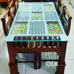 Teak wood dinner table with 6 chairs.