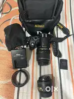 Nikon D3100 camera with 18-55 mm and 35 mm 1:1.8 G lenses
