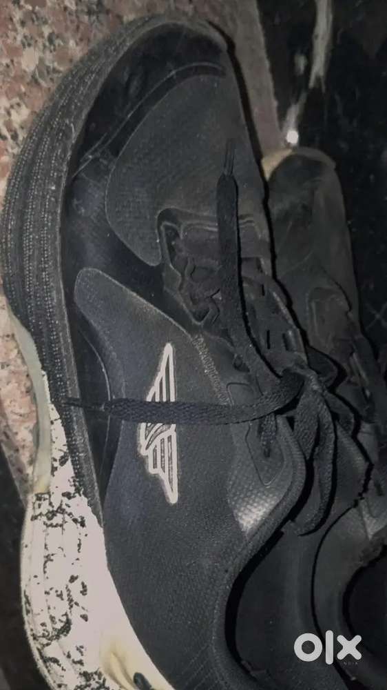 Red tape running shoes