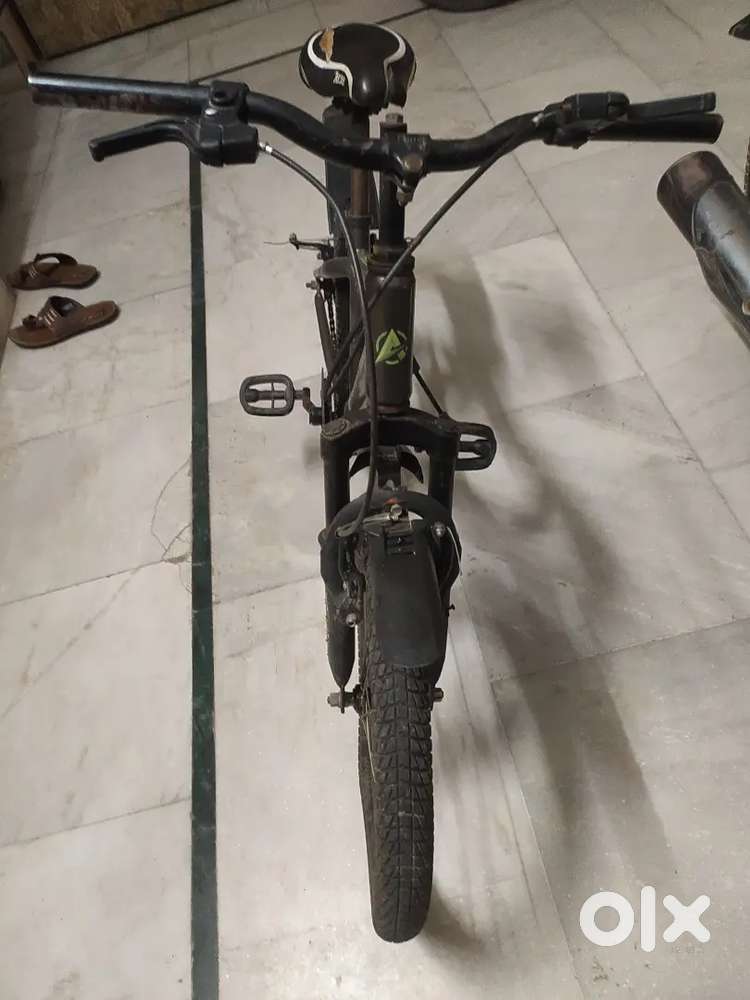 A bicycle of orange colour