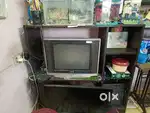 TV stand make by wood and look like neat condition