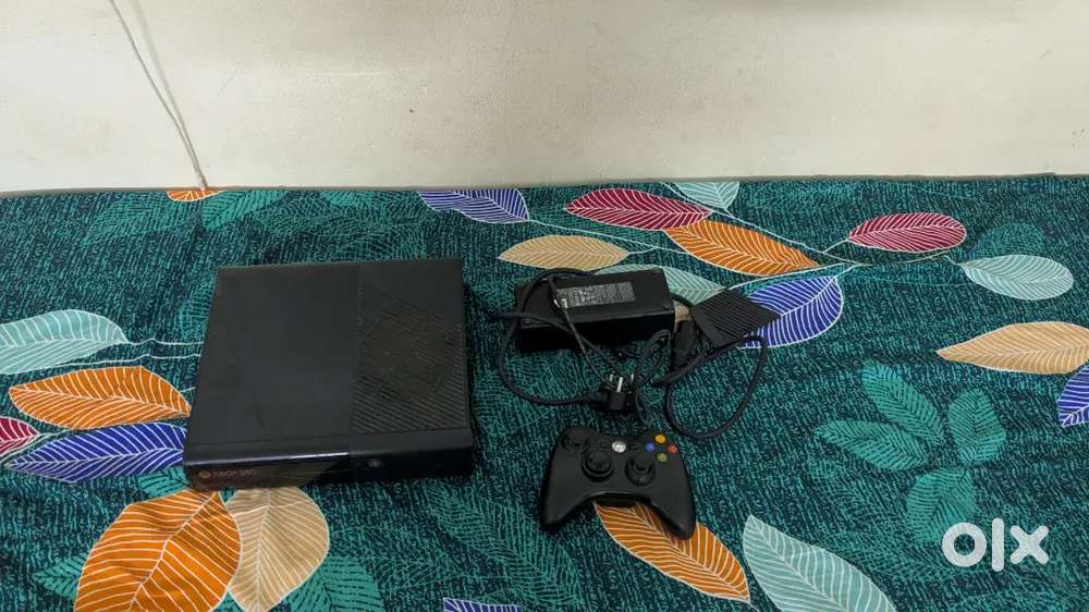 Xbox 360 with controller and 7 games