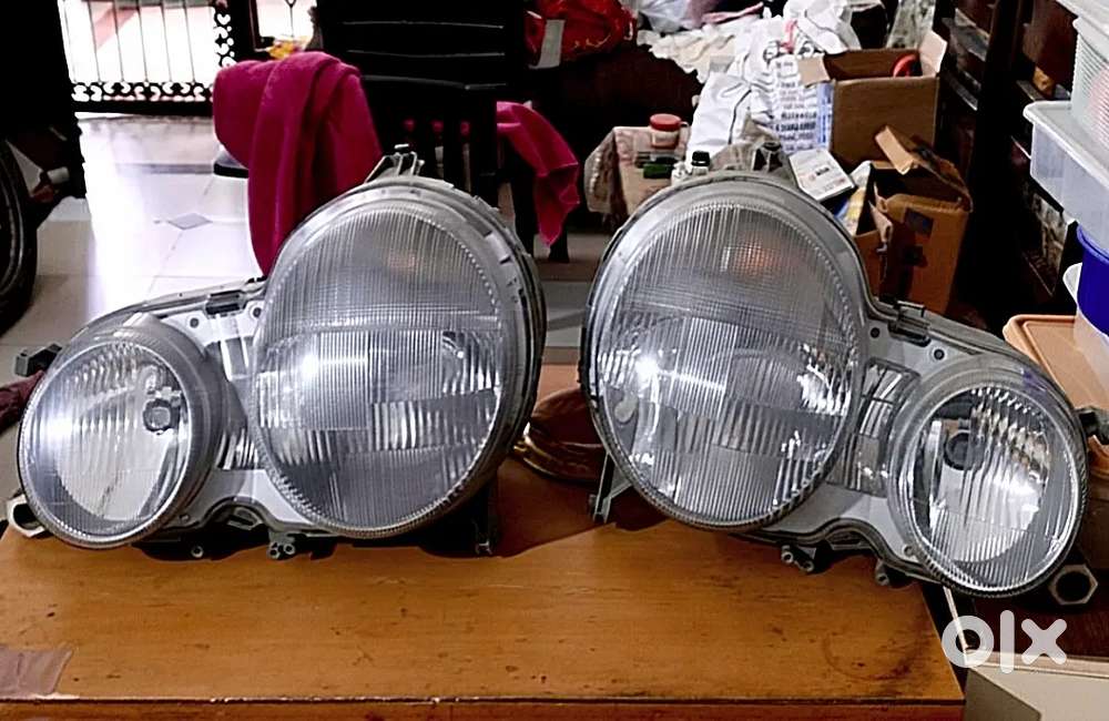 Mercedes W210 Hella German Headlights pair for sale.
