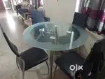 Godrej glass dining table with set of 4 Chairs