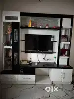 Tv unit with many compartments and colourful lights. 2 years old.