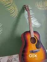 Guitar with wodden furnished bought for my children but never used it