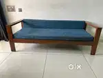 wooden sofa with cushion