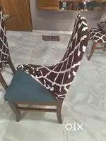 6 Seater wooden frame glass top dining table with 6 chairs.