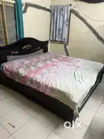 6X6 size bed with mattresses and storage space under both the beds