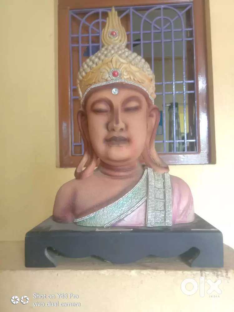 Ancient Buddha face statue