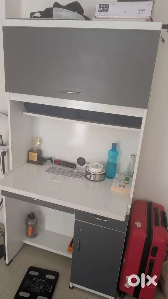 Almost brand new study table with storage racks and study light