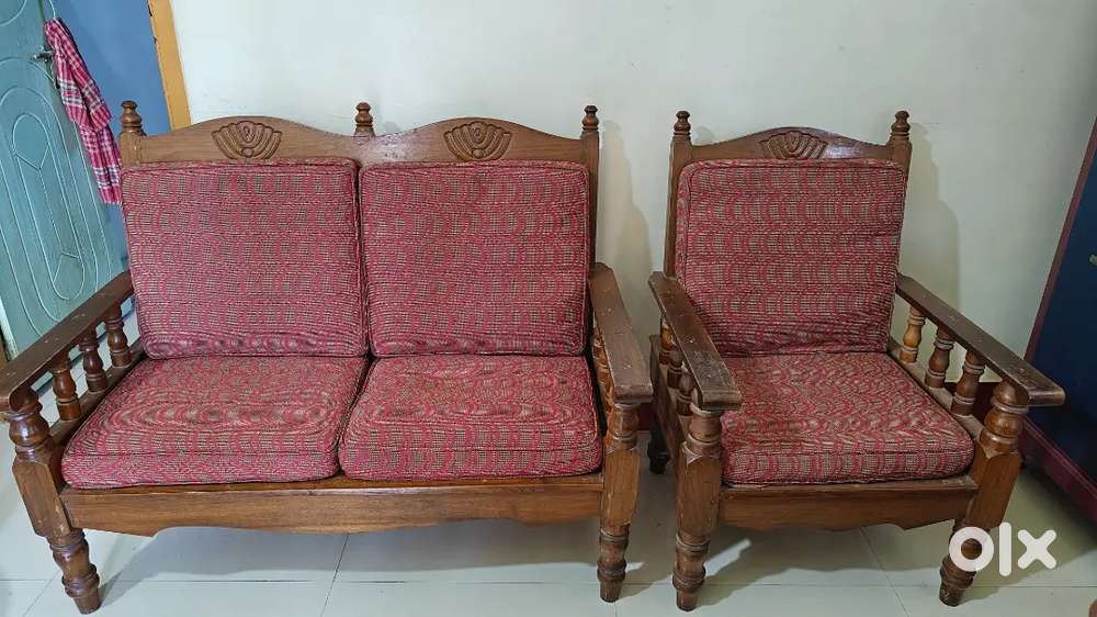 Three Wooden Sofas With Cushions And Covers
