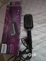 Hair straightening brush in working condition.