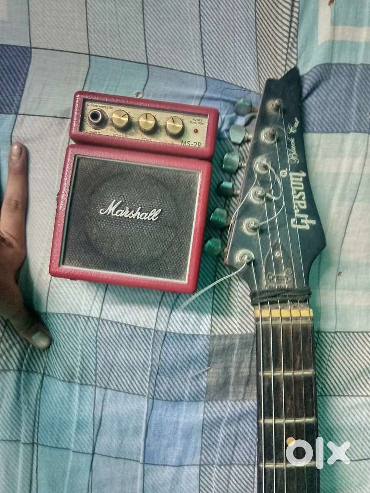 Very good condition electric guitar and portable amplifier marshall