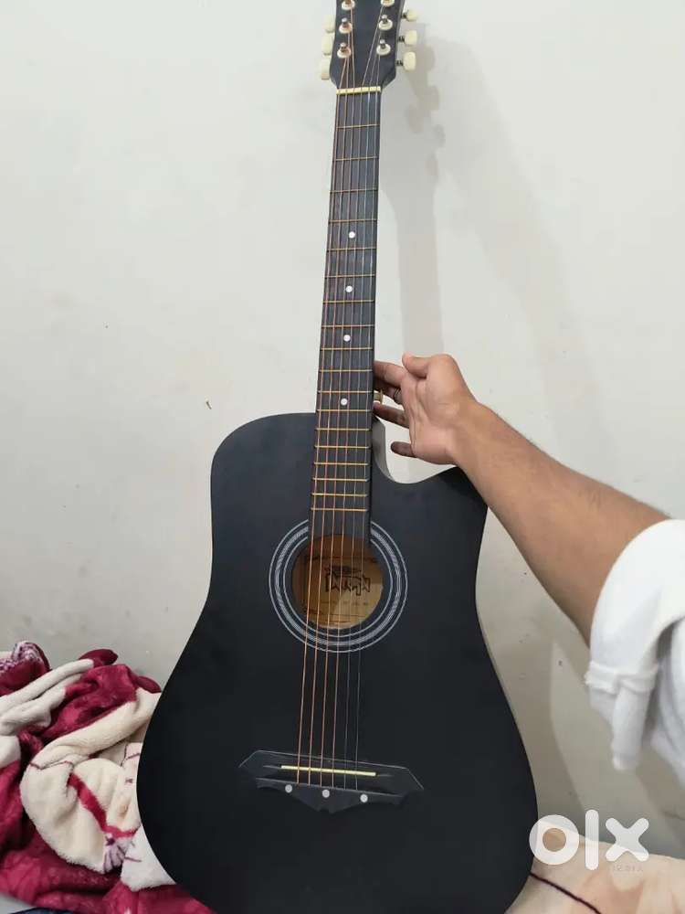 Our Guitar is 3 months old , Black guitar
