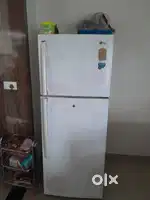 LG full size fridge And Center table