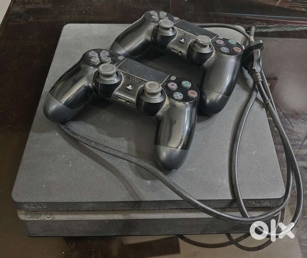 PlayStation 4 Slim in best condition with 2 games and two controllers.