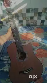 Guitar in brown colour with new condition only 2-3 times use .