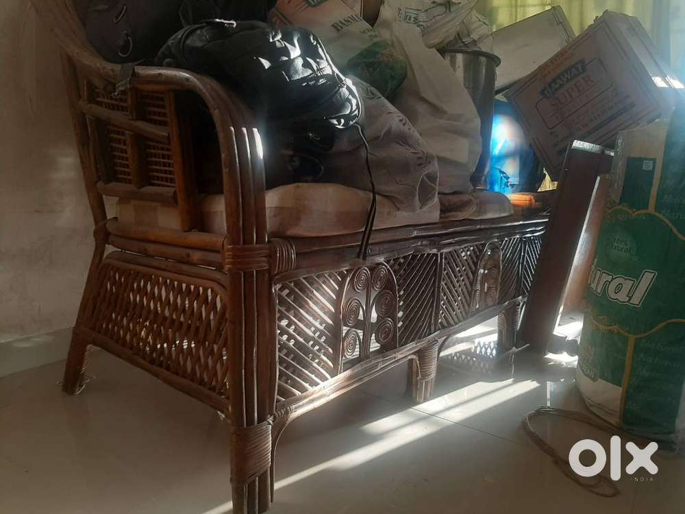 Cane sofa with cushions