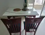 Wooden Dining table with marble top.