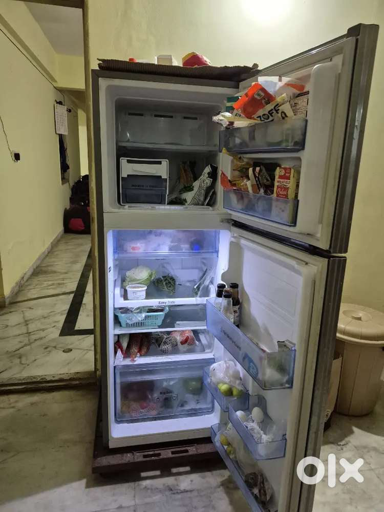 Double door Fridge and top load automatic washing machine