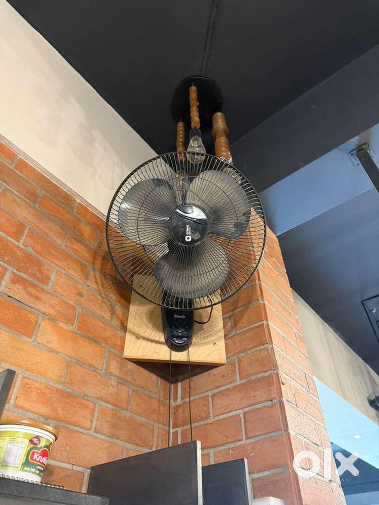 One standing fan and one wall hanging