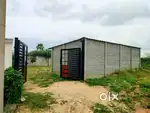 West facing Open plot with compound wall and gate.