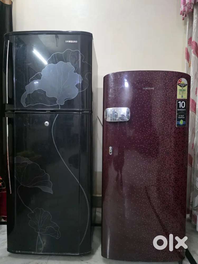 Two red and black coloured Samsung refrigerators for sale.