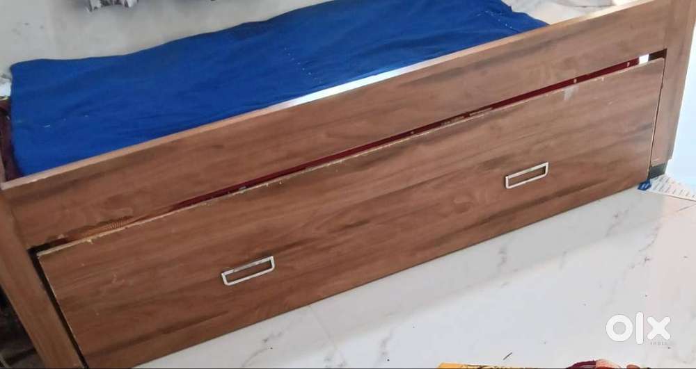 Single bed in metal body with wooden finished