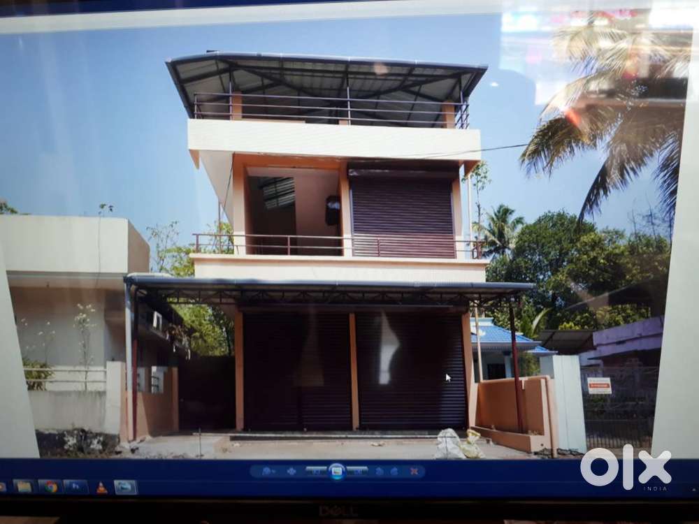 J J BUILDING IN OLD RAILWAY STATION ROAD ANGAMALY.