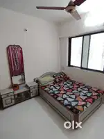 4 × 6 folding bed with bedsheet dressing table with mirror.