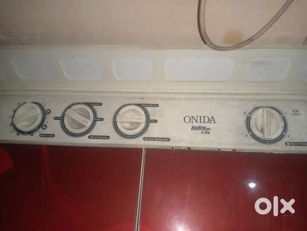 Red and white washing machine in best condition.