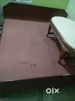 Wooden bed and table in good condition
